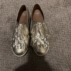 BP Gold Ruffle Slip-On Shoes